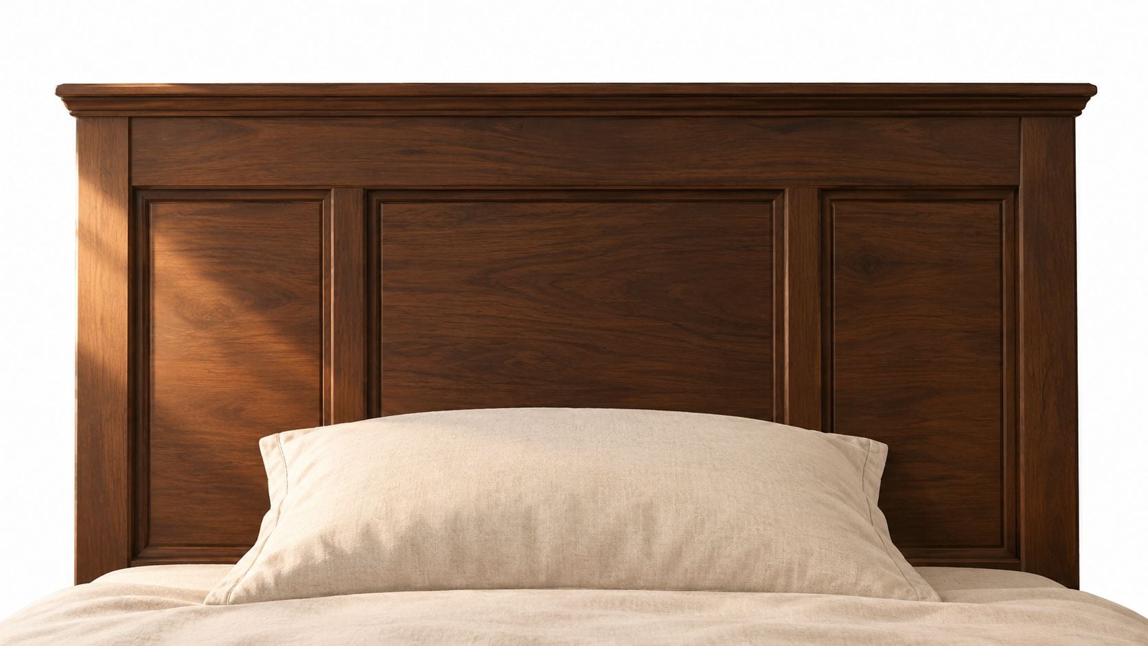 A sophisticated dark wood headboard centered behind a single plush beige pillow on a neatly made bed.